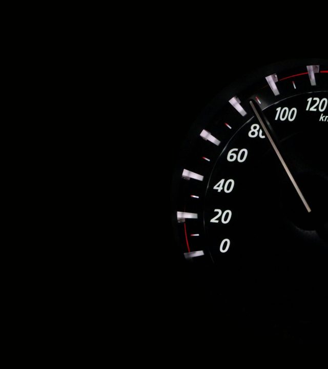 Speedometer reading showing speed in km/h on a dark background.